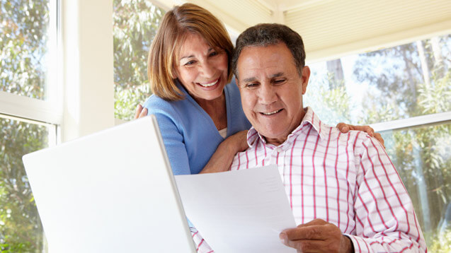 Couple of seniors reading a document