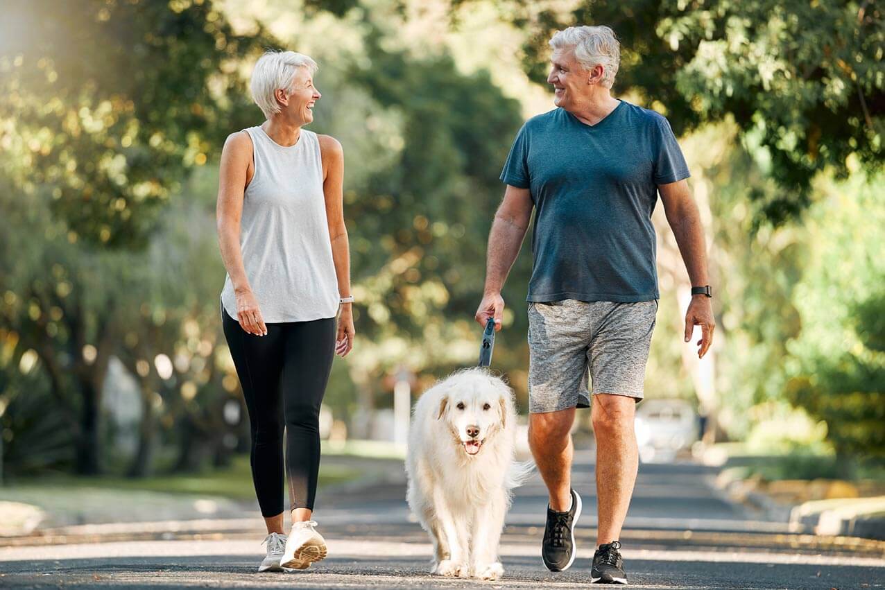 two healthy seniors walking