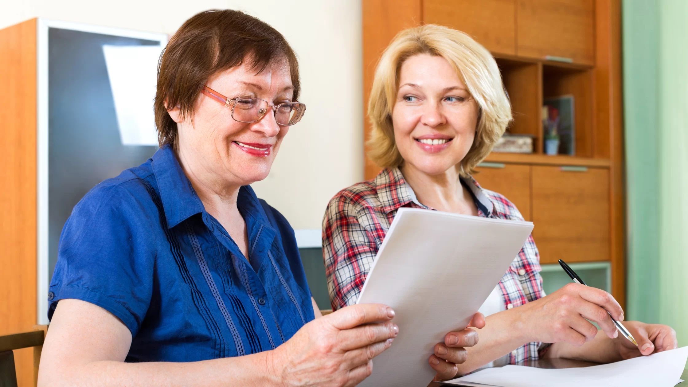 Seniors signing a reverse mortgage